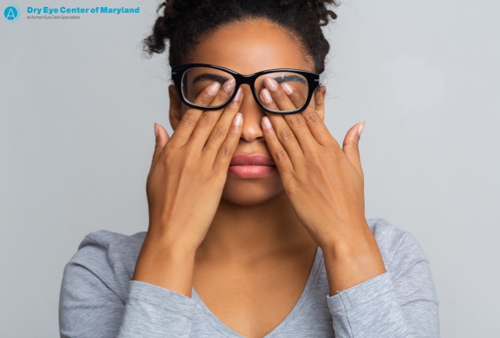 African American woman rubbing her eyes from eye allergy and dry eye